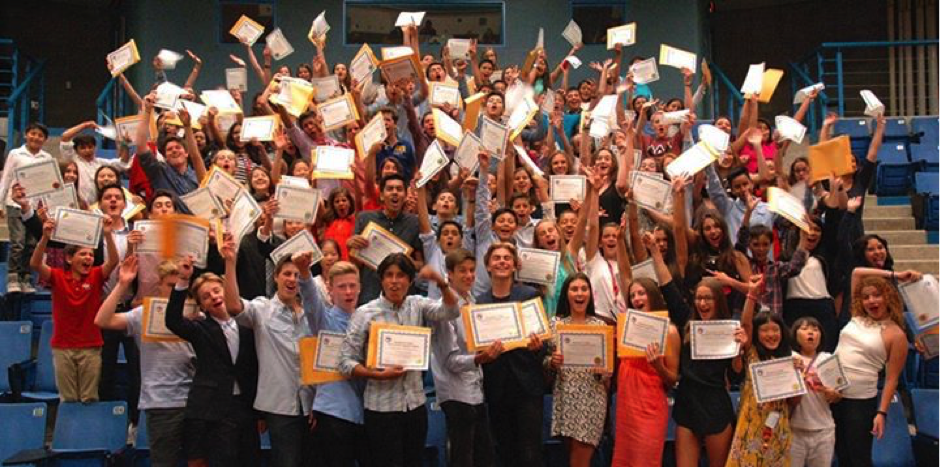 Kids show off their Destination Canada diplomas - an important achievement in language learning!
